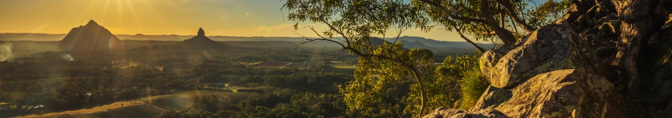 Image looking over the Glasshouse Mountains at sunset